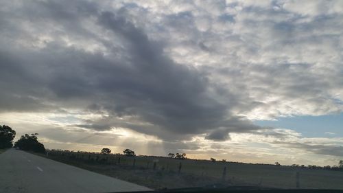 Scenic view of road against sky during sunset