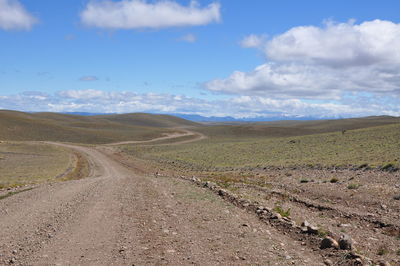 Dirt road passing through landscape