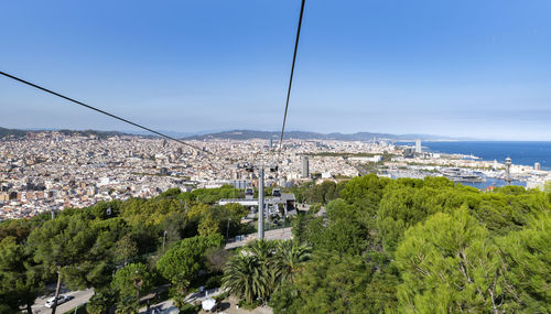 High angle view of trees and buildings against sky