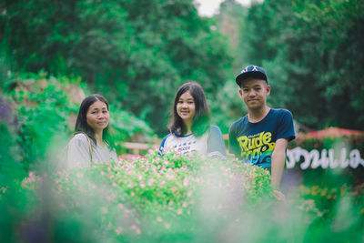 Group of people against plants