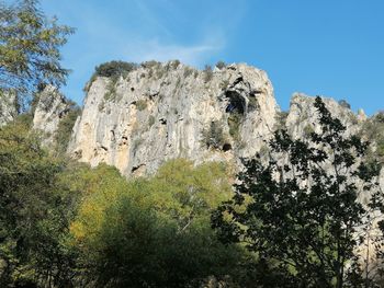 Low angle view of rocks against sky