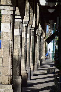 Rear view of woman walking on corridor