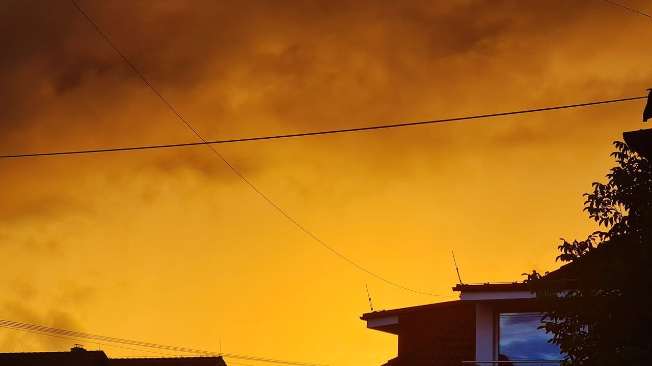 LOW ANGLE VIEW OF SILHOUETTE BUILDINGS AGAINST SKY DURING SUNSET