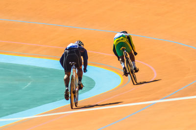 High angle view of people riding bicycle