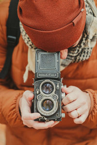 Midsection of man photographing