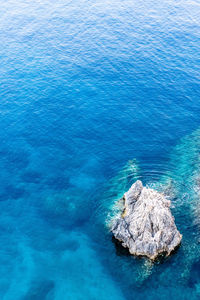 Aerial view of rock formation in sea