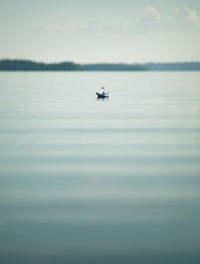 Sailboat on sea against sky