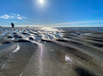 Scenic view of sea against sky during winter