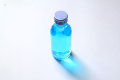 High angle view of bottle against white background