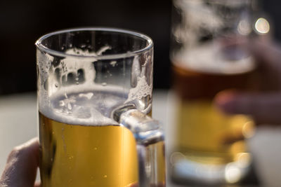 Close-up of beer glass on table