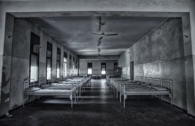 Empty chairs and table in building