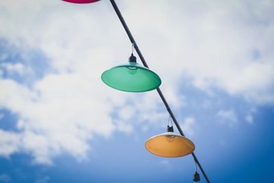 Low angle view of toy hanging against sky