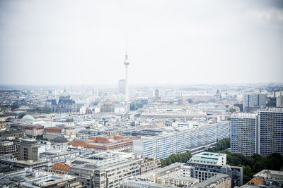 Buildings in city against sky