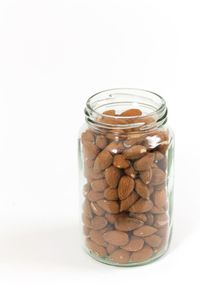 Close-up of jar against white background