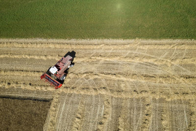 Aerial photographic documentation of the work of a grain harvester during the summer season