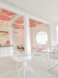 White chairs and tables in cafe