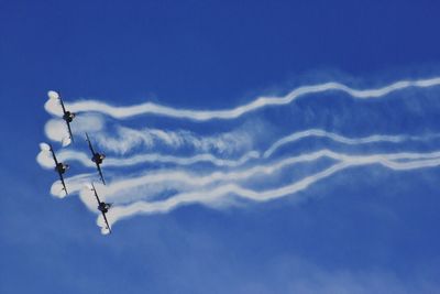 Low angle view of airplane flying in sky