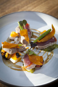 High angle view of fruits in plate on table