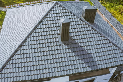 Low angle view of building roof against sky