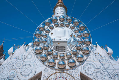 Low angle view of dome of building against blue sky