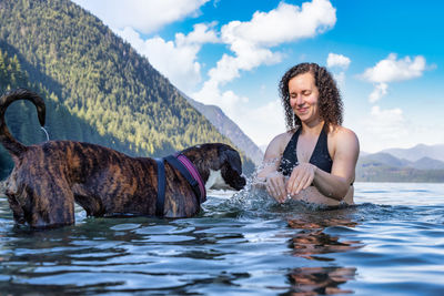 Man with dog in the water