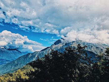 Scenic view of snowcapped mountains against sky