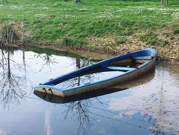 High angle view of boat moored in lake