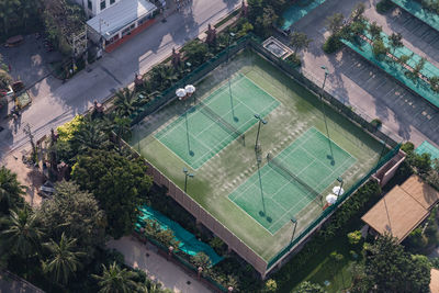 High angle view of swimming pool amidst buildings in city