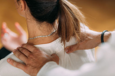 Woman enjoying shiatsu neck and shoulders massage.