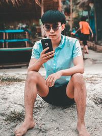 Young man using mobile phone