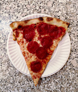 High angle view of pizza in plate on table