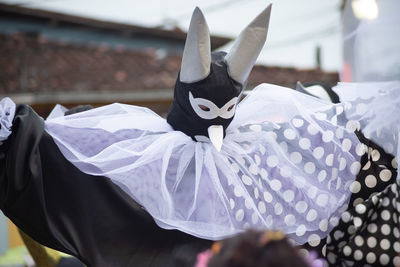 People wearing venetian carnival-style masks are seen during the carnival 