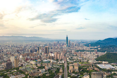 High angle view of modern buildings in city against sky