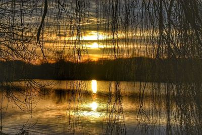 Scenic view of lake against sky during sunset