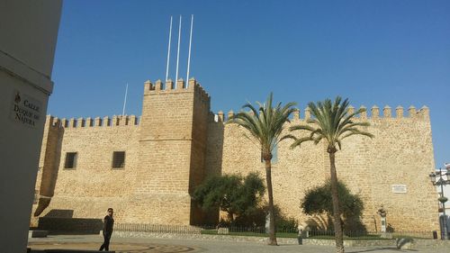 Low angle view of building against blue sky