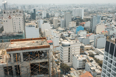 High angle view of buildings in city on sunny day