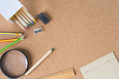 Directly above shot of school supplies on table