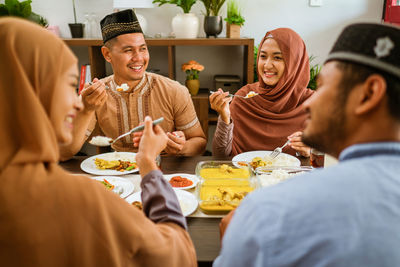 Friends having food at home