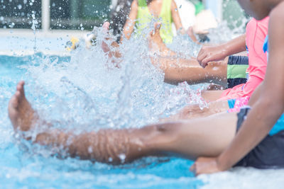 People enjoying in swimming pool