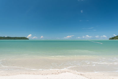 Scenic view of sea against blue sky