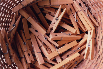 Directly above shot of clothespins in wicker basket