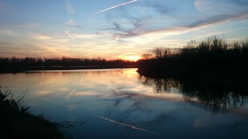 Scenic view of lake against sky during sunset