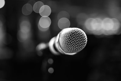 Black and white microphone close-up with background bokeh