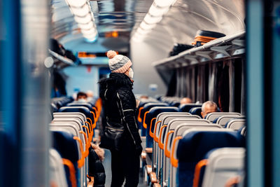 Rear view of people in train