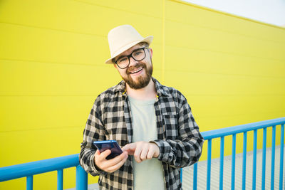 Portrait of man using smart phone