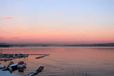 Scenic view of lake against sky during sunset