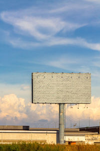 Built structure on field against sky