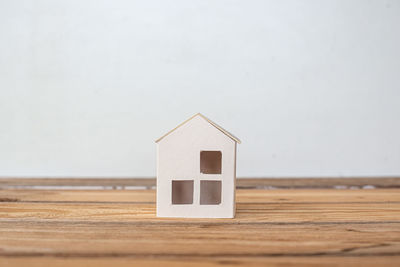 Close-up of house on white wall of building