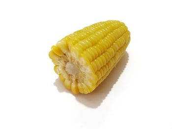 Close-up of lemon slice over white background