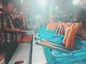 Panoramic shot of illuminated market stall at restaurant